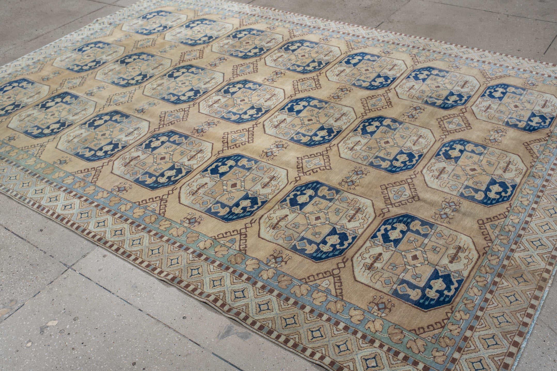 7' x 10' one-of-a-kind handmade vintage Hooked large size rug. Color palette: ivory, sky_blue, navy, tan, camel, taupe