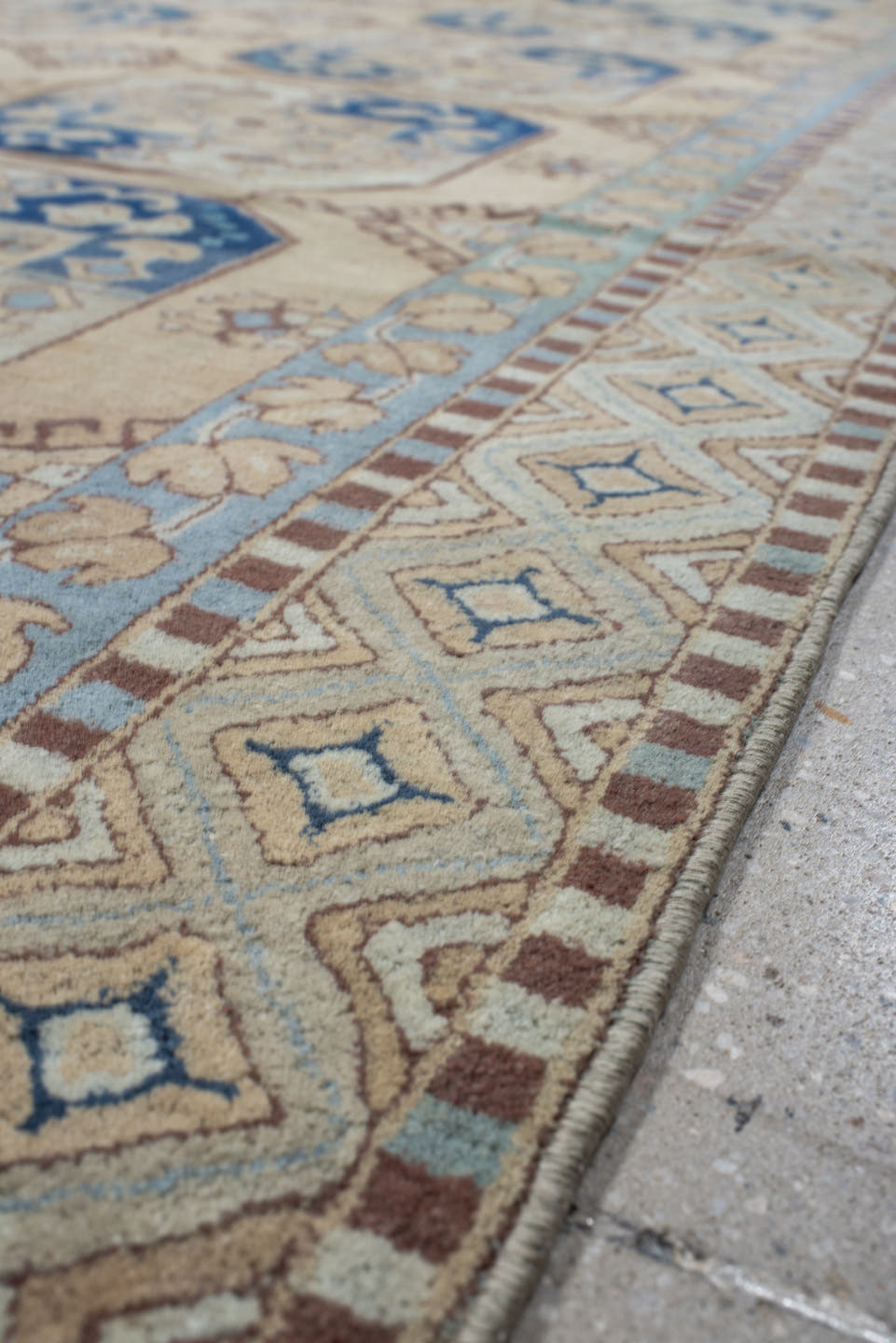 7' x 10' one-of-a-kind handmade vintage Hooked large size rug. Color palette: ivory, sky_blue, navy, tan, camel, taupe