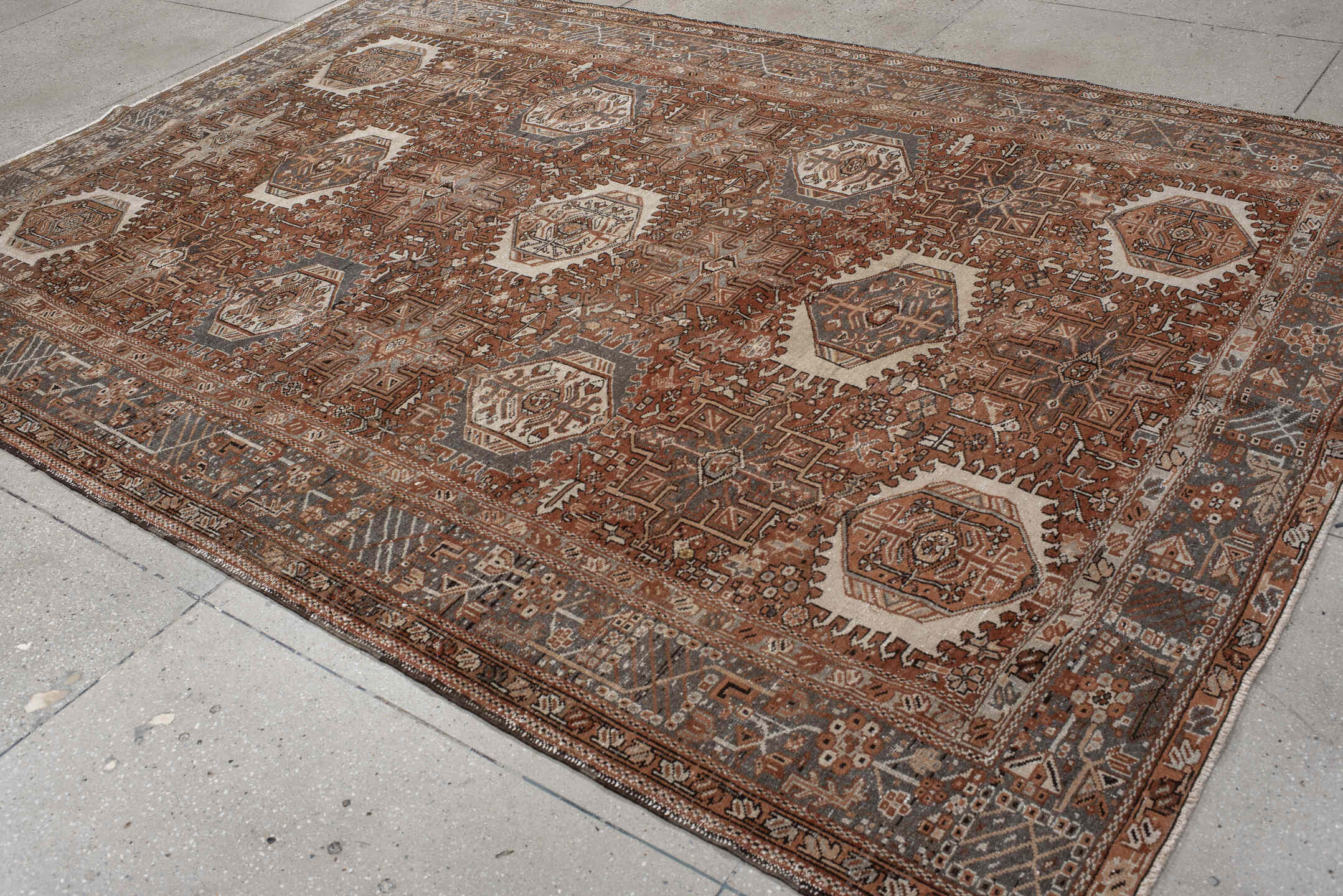 7' x 10' one-of-a-kind handmade vintage Karaje large size rug. Color palette: rust, brown, ivory, slate, taupe, camel
