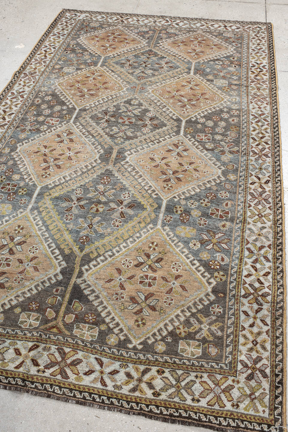 4' x 8' one-of-a-kind handmade vintage Shiraz rug. Color palette: slate, ivory, camel, taupe, rust, charcoal, sage, gold