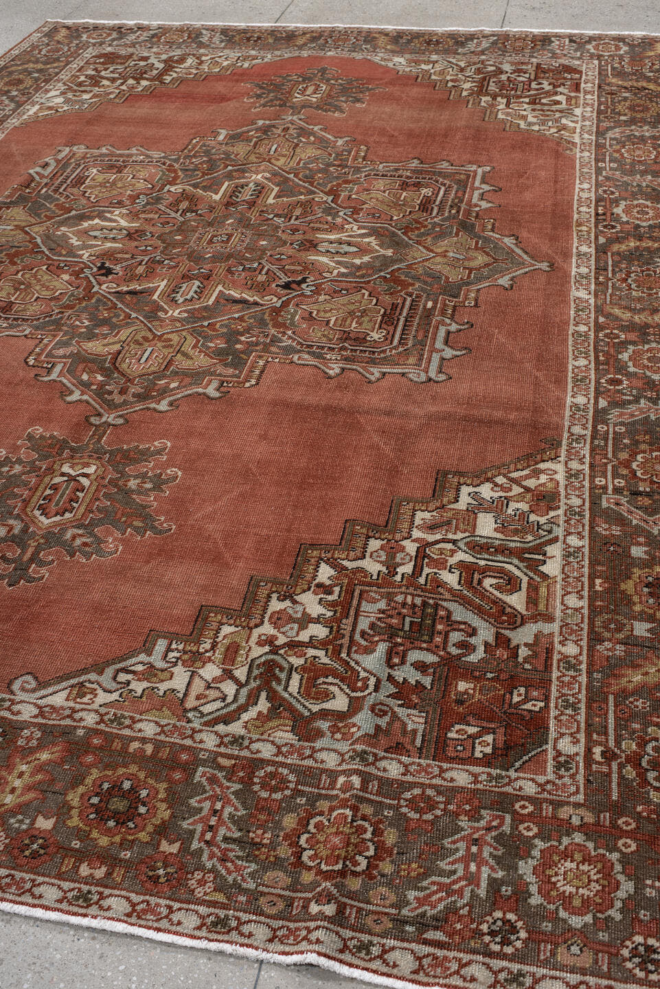 8' x 11' one-of-a-kind handmade antique Heriz large size rug. Color palette: terra cotta, ivory, charcoal, rust, sage, taupe