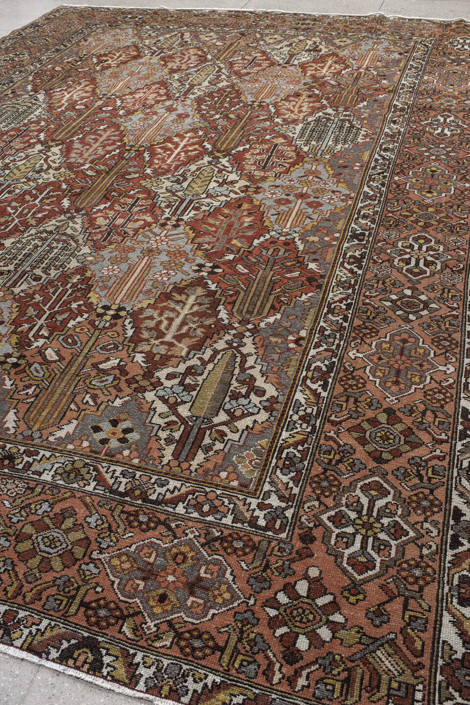 10' x 14' one-of-a-kind handmade vintage Baktiary large size rug. Color palette: rust, slate, ivory, rose, taupe, gold