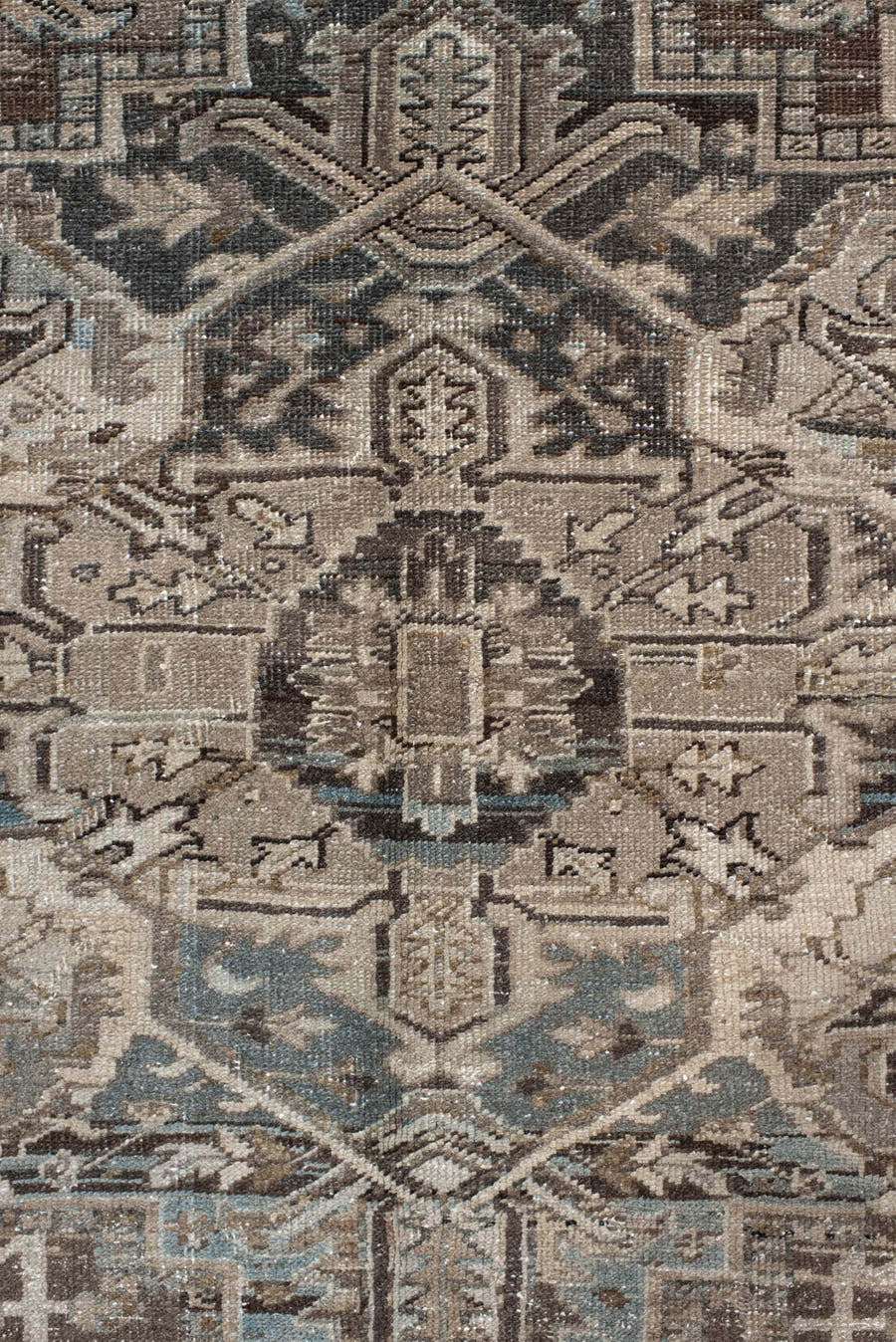 7' x 10' one-of-a-kind handmade antique Heriz large size rug. Color palette: taupe, brown, ivory, charcoal, faded blue