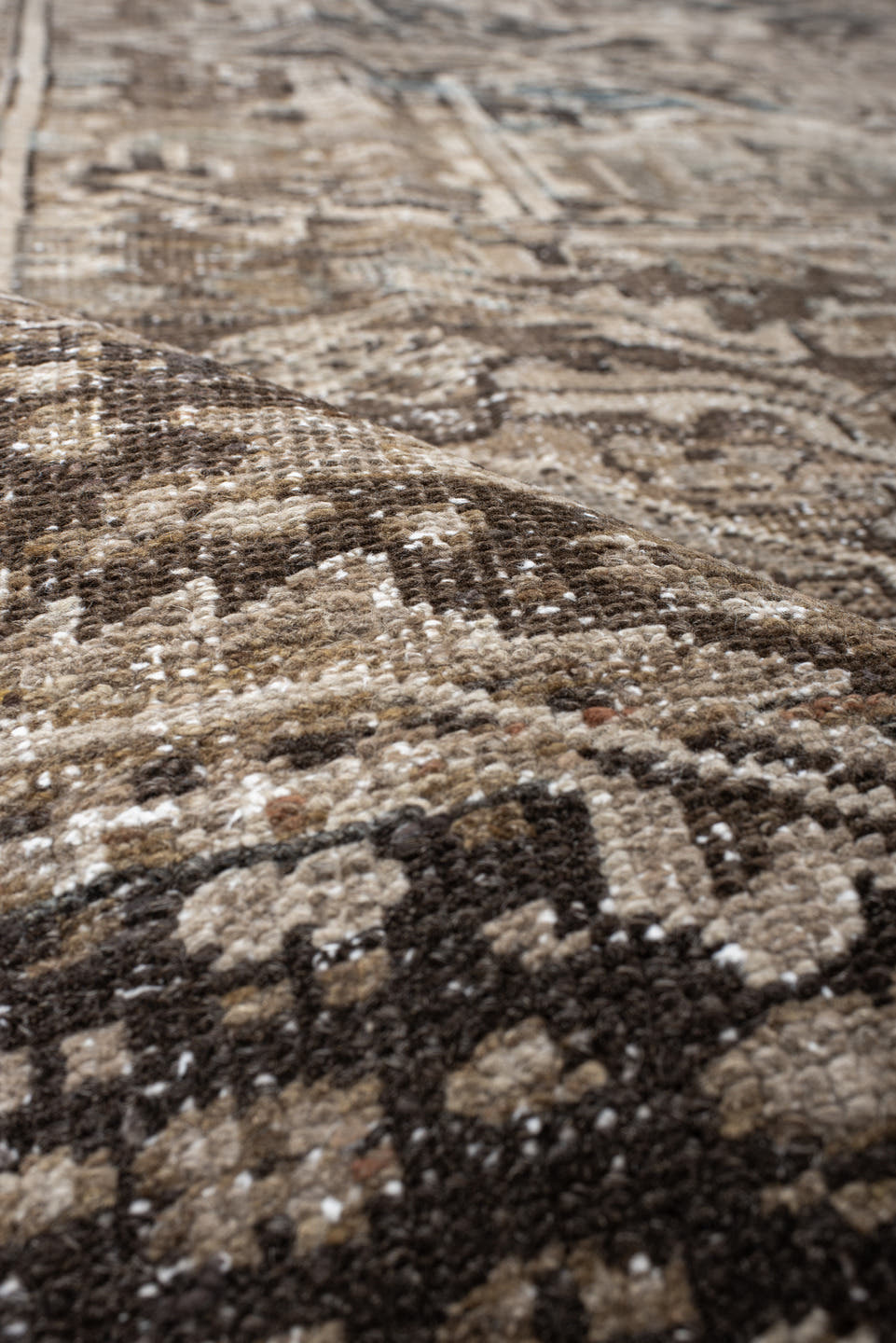 7' x 10' one-of-a-kind handmade antique Heriz large size rug. Color palette: taupe, brown, ivory, charcoal, faded blue
