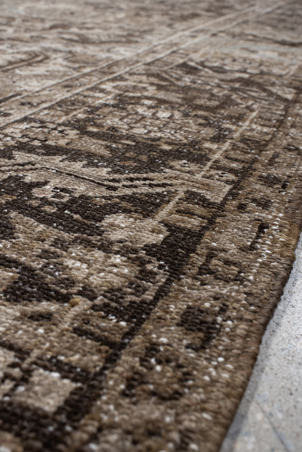 7' x 10' one-of-a-kind handmade antique Heriz large size rug. Color palette: taupe, brown, ivory, charcoal, faded blue