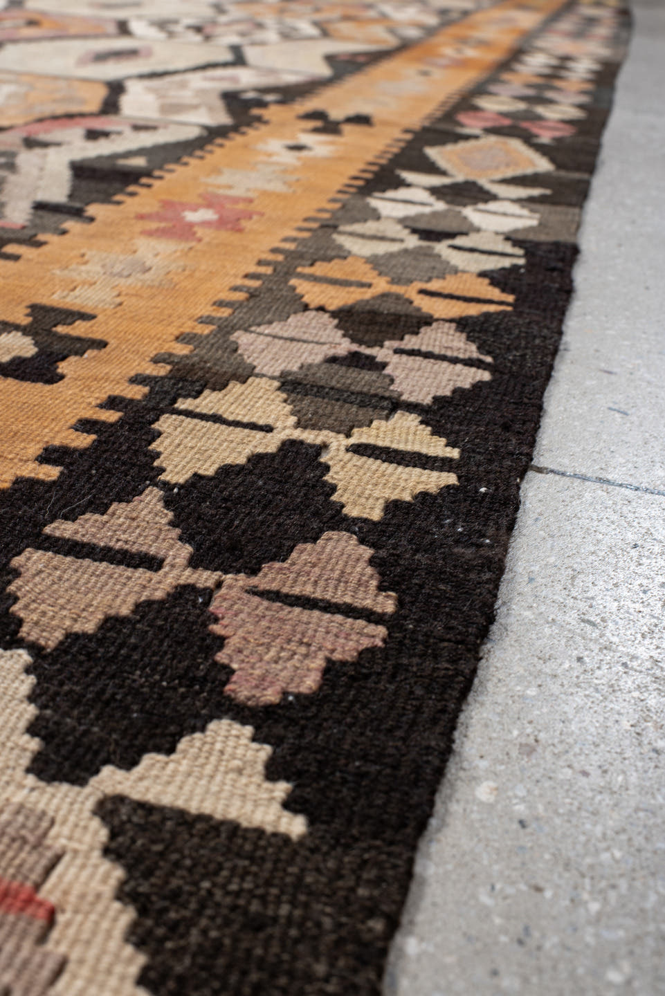 6' x 12' one-of-a-kind handmade antique Kilim large size rug. Color palette: camel, brown, taupe, ochre, ivory, plum