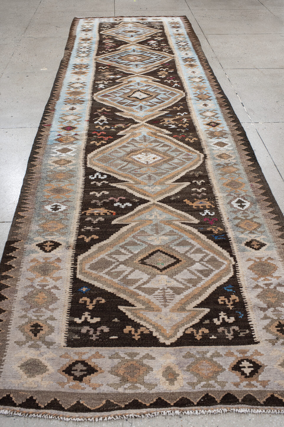 4' x 14' one-of-a-kind handmade antique Kilim runner rug. Color palette: brown, sky blue, taupe, ivory, camel, charcoal