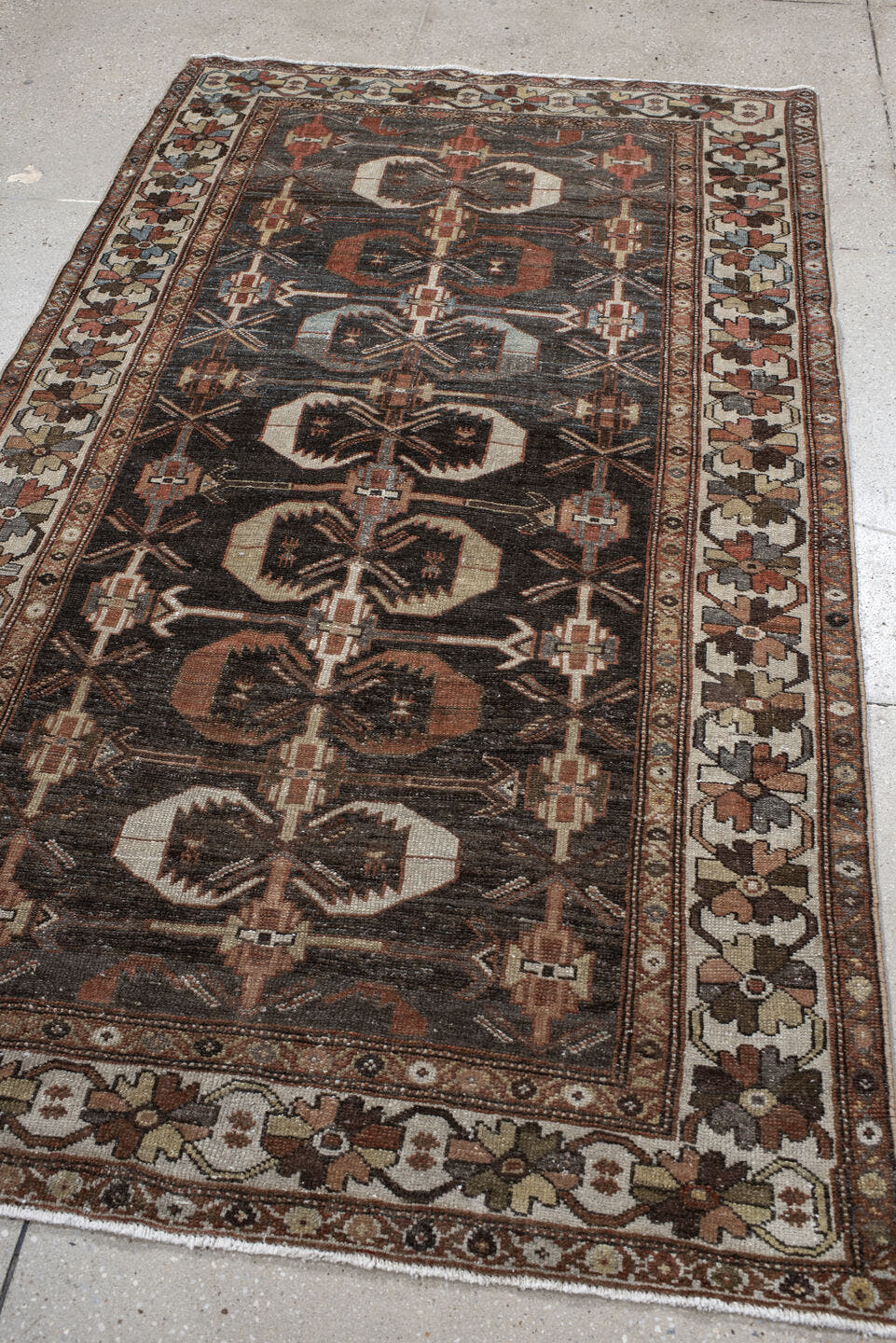 4' x 7' one-of-a-kind handmade antique Shirvan rug. Color palette: charcoal, ivory, rust, taupe, slate, camel, terracotta