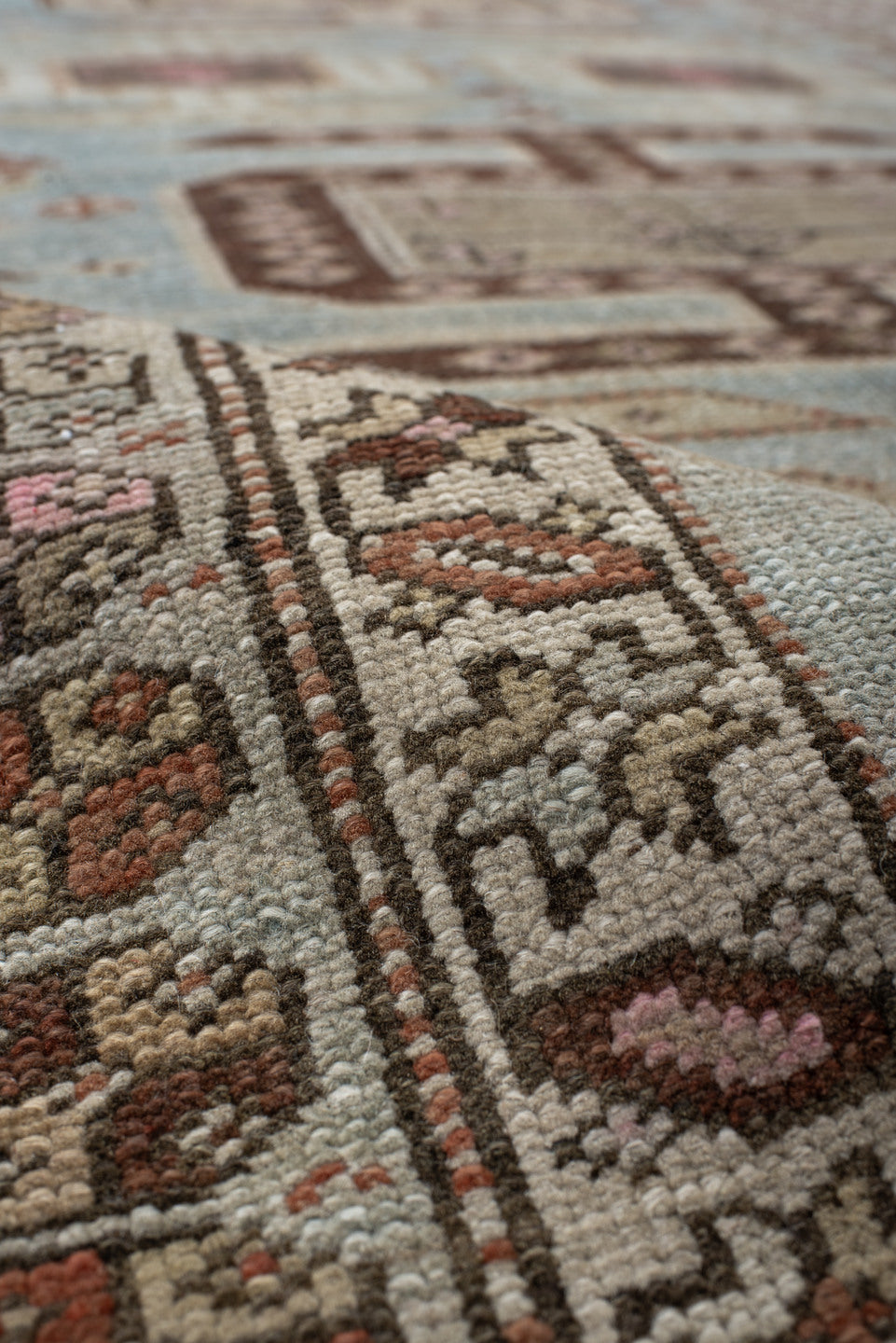 3' x 11' one-of-a-kind handmade vintage runner rug. Color palette: ivory, sky blue, brown, rust, taupe, rose, charcoal