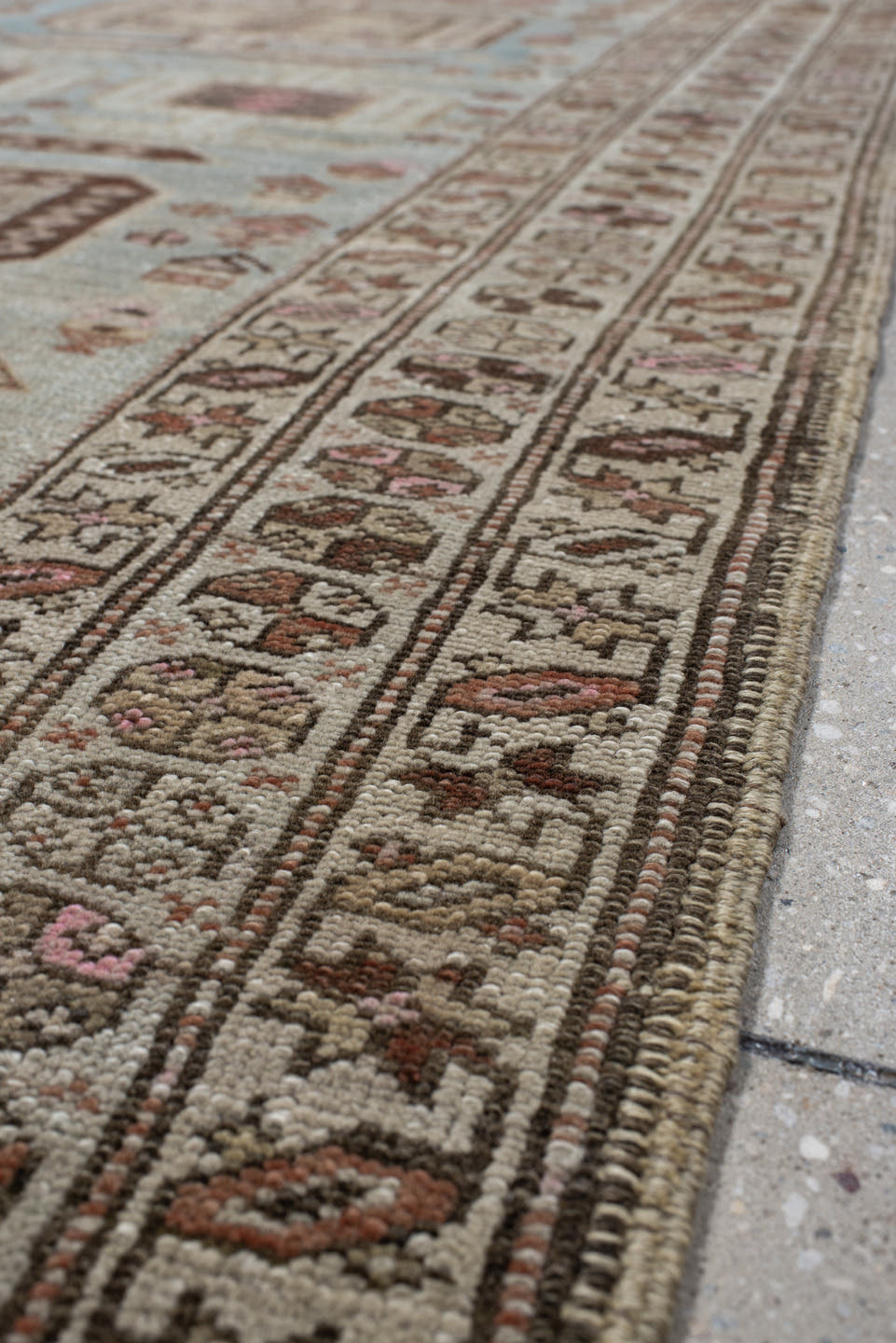 3' x 11' one-of-a-kind handmade vintage runner rug. Color palette: ivory, sky blue, brown, rust, taupe, rose, charcoal