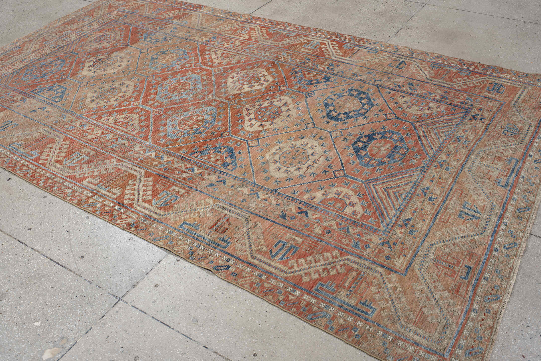 6' x 10' one-of-a-kind handmade antique Belouch large size rug. Color palette: rust, ivory, blue, terra cotta, camel, slate