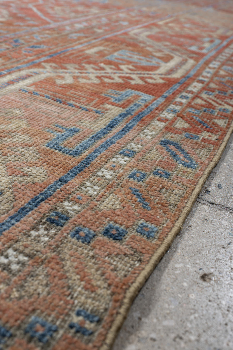 6' x 10' one-of-a-kind handmade antique Belouch large size rug. Color palette: rust, ivory, blue, terra cotta, camel, slate