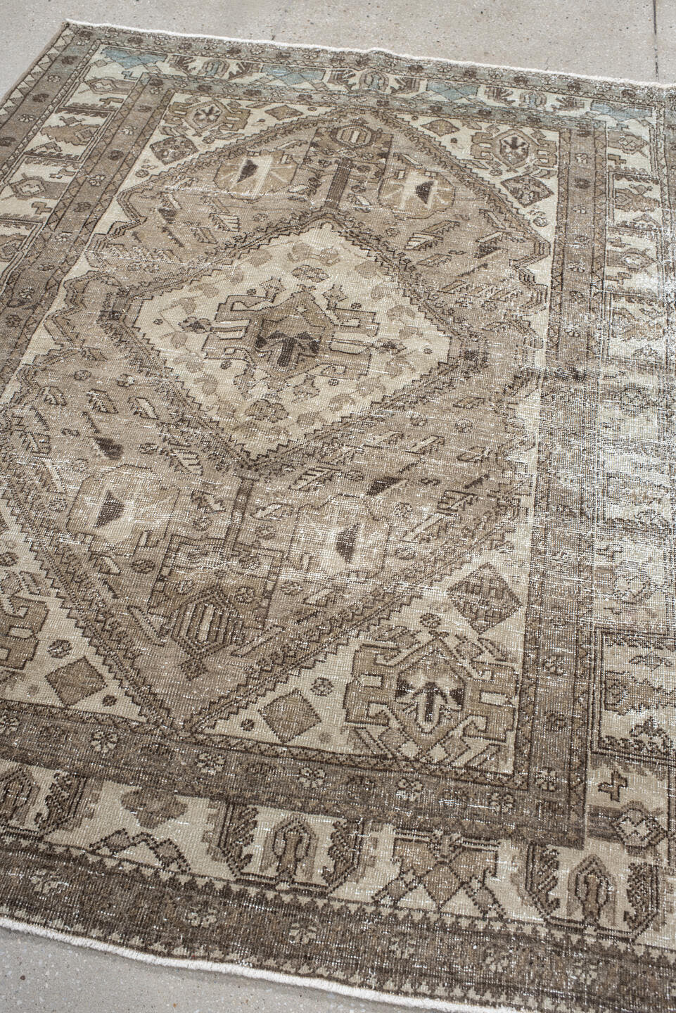 5' x 6' one-of-a-kind handmade vintage Sarab rug. Color palette: ivory, taupe, brown, camel, pale_blue, beige, gray