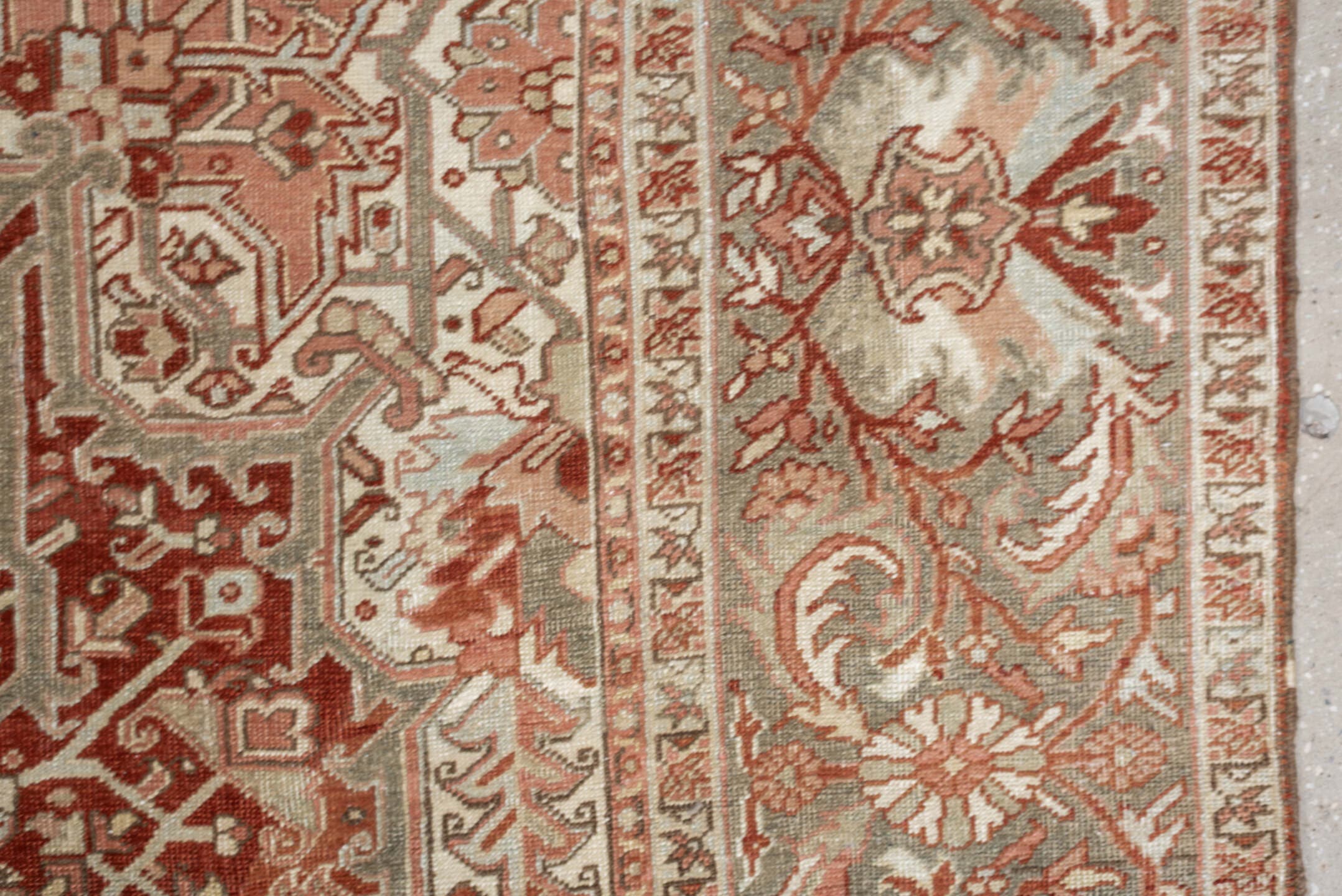 12' x 9' one-of-a-kind handmade vintage Heriz rug. Color palette: terracotta, ivory, pale blue, blue gray, camel, rust