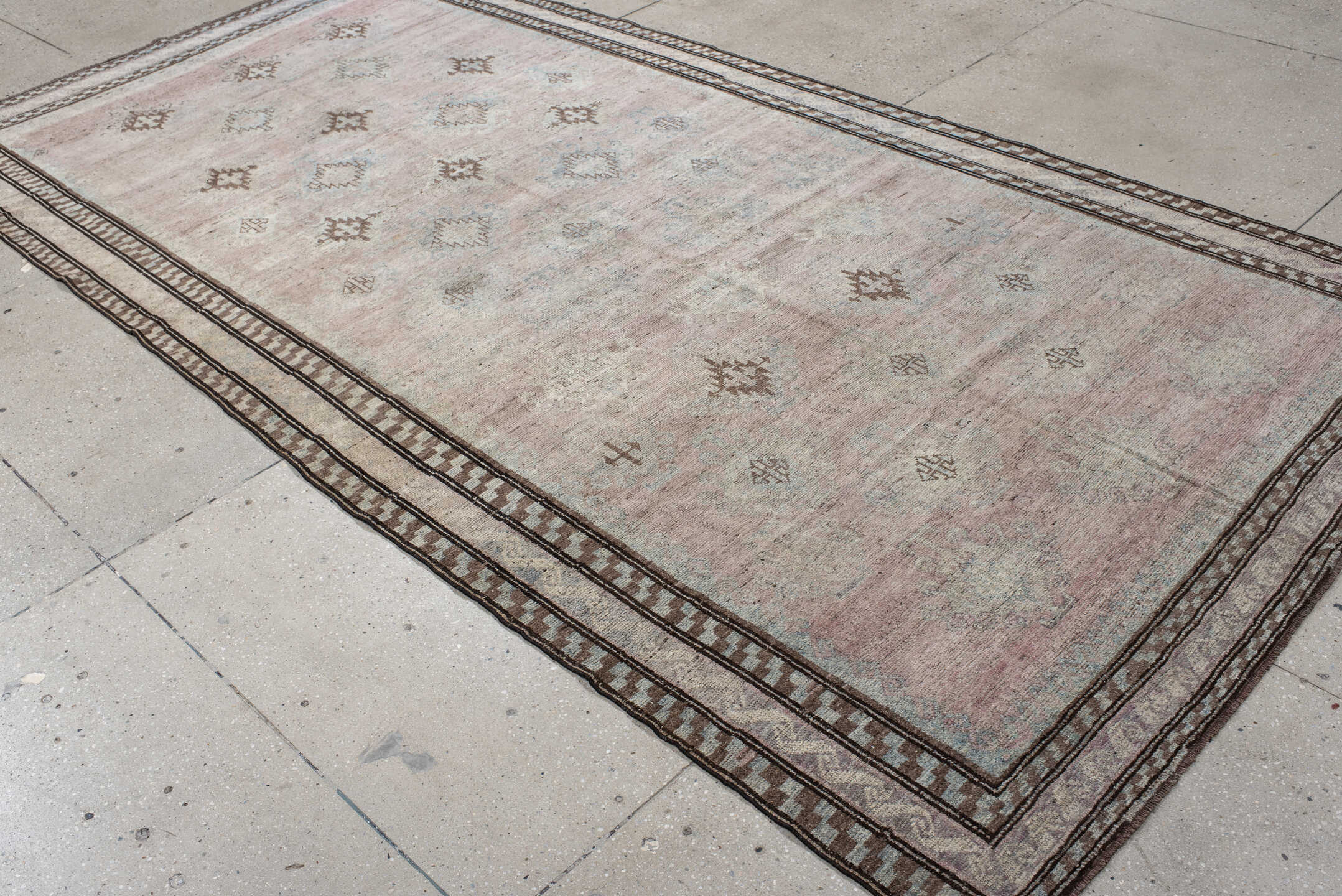 5' x 11' one-of-a-kind handmade vintage rug. Color palette: blush, ivory, taupe, pale blue, brown, beige, pink, gray