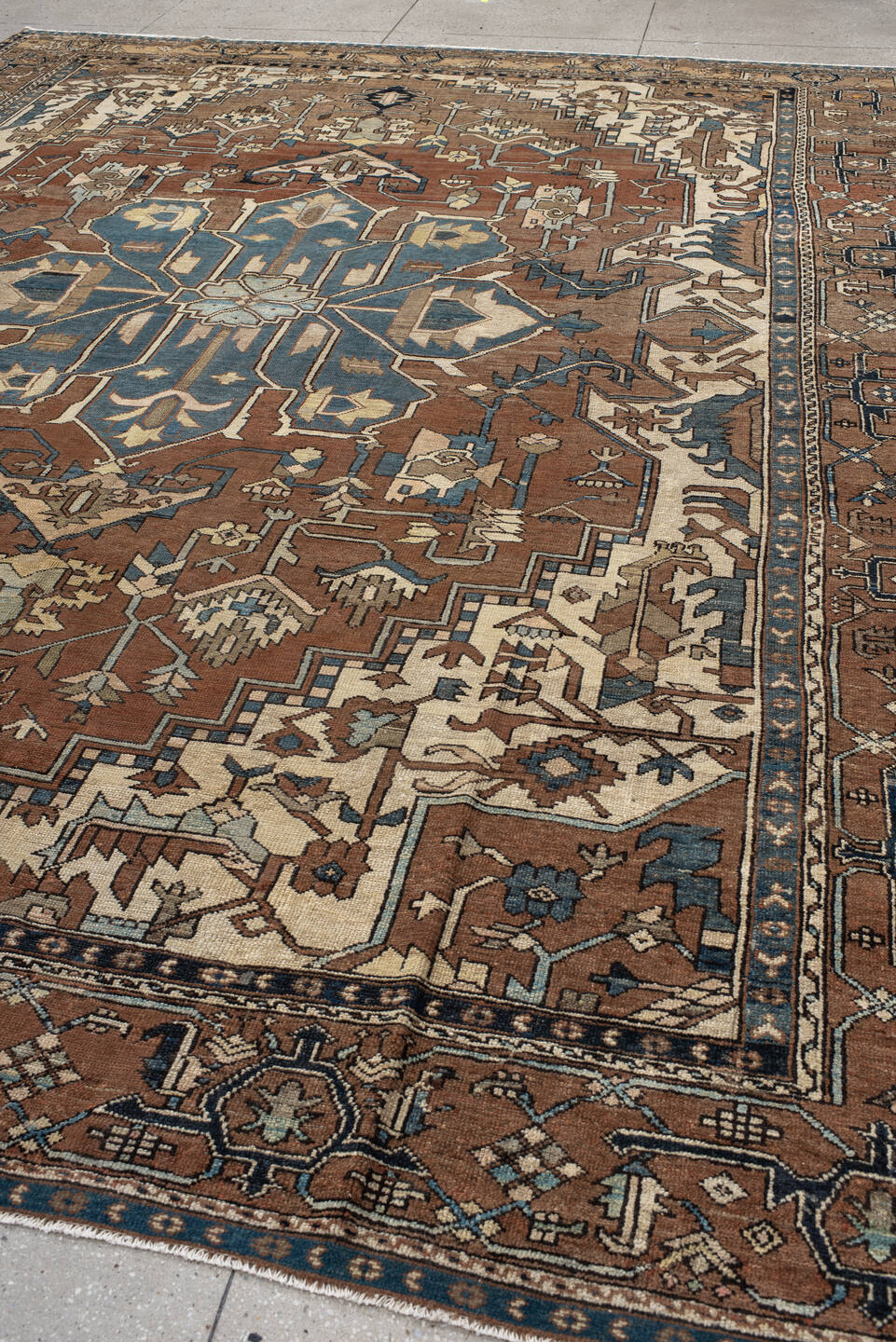 11' x 14' one-of-a-kind handmade vintage Serapi oversize rug. Color palette: gray, blue, brown, black, off-white, dark gray