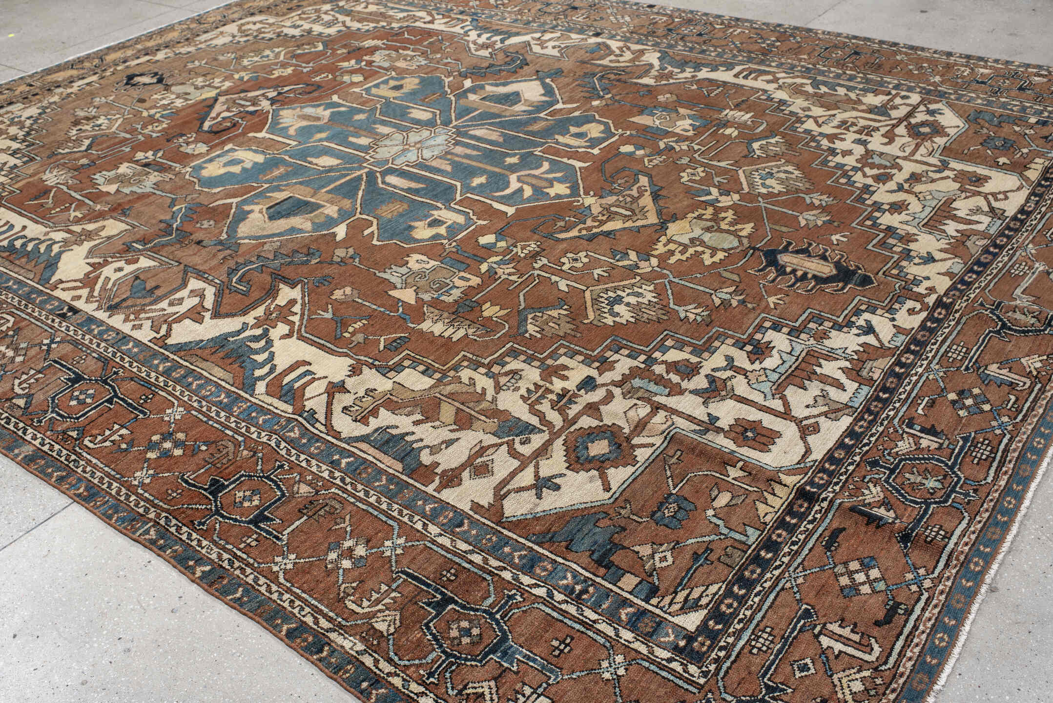 11' x 14' one-of-a-kind handmade vintage Serapi oversize rug. Color palette: gray, blue, brown, black, off-white, dark gray
