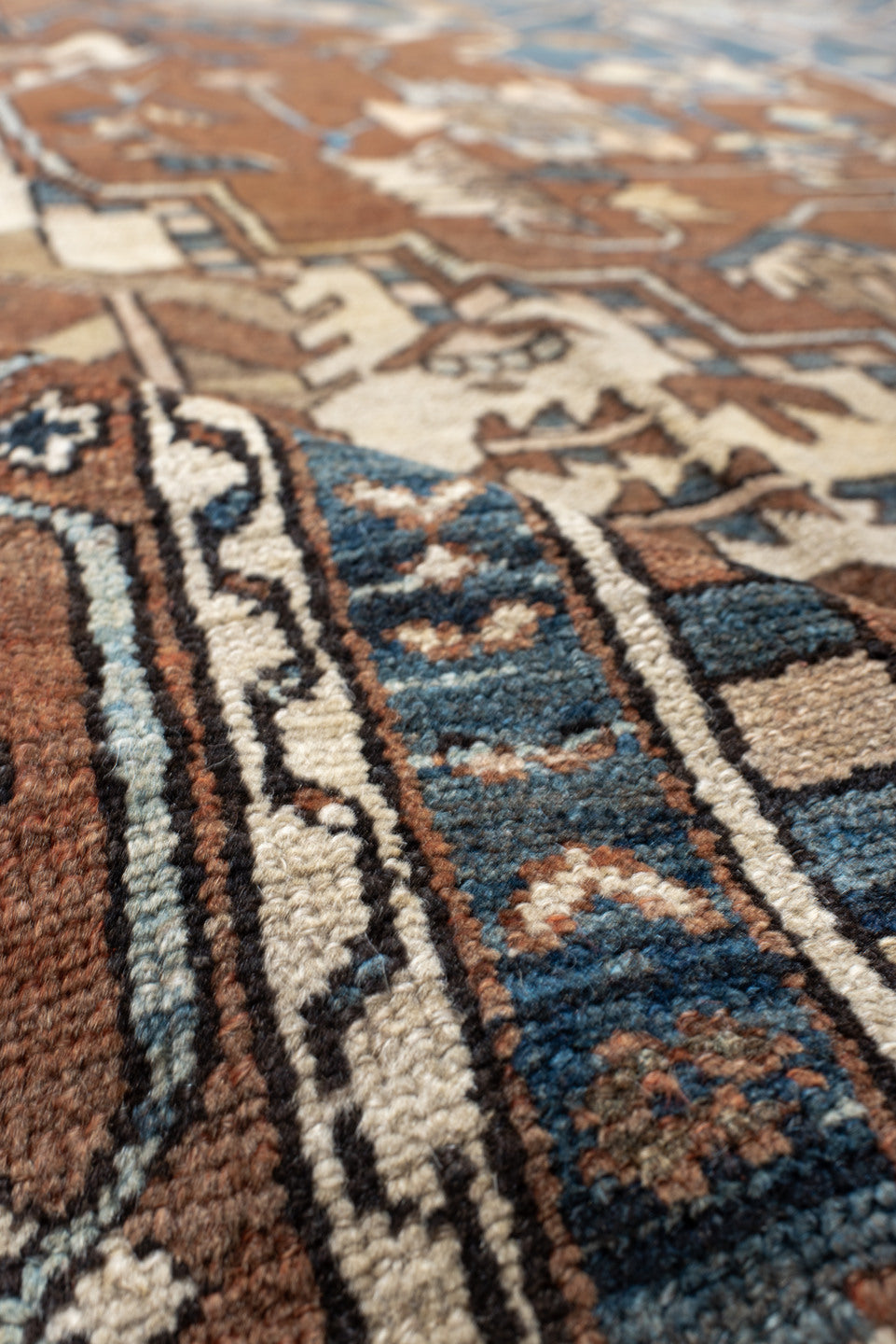 11' x 14' one-of-a-kind handmade vintage Serapi oversize rug. Color palette: gray, blue, brown, black, off-white, dark gray