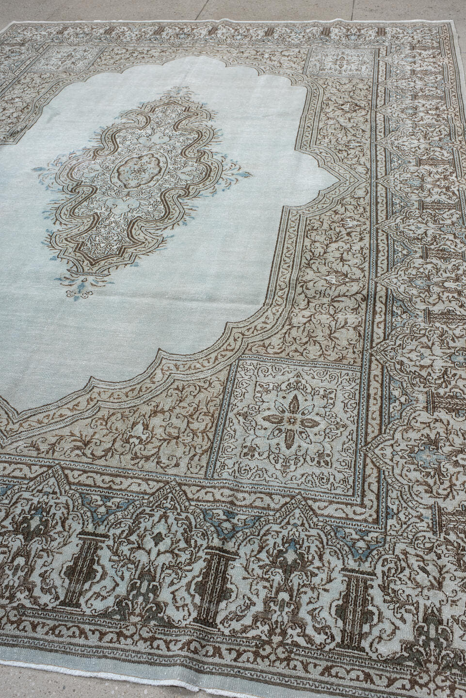 9' x 12' one-of-a-kind handmade vintage large size rug. Color palette: pale blue, ivory, taupe, brown, sky blue, light blue
