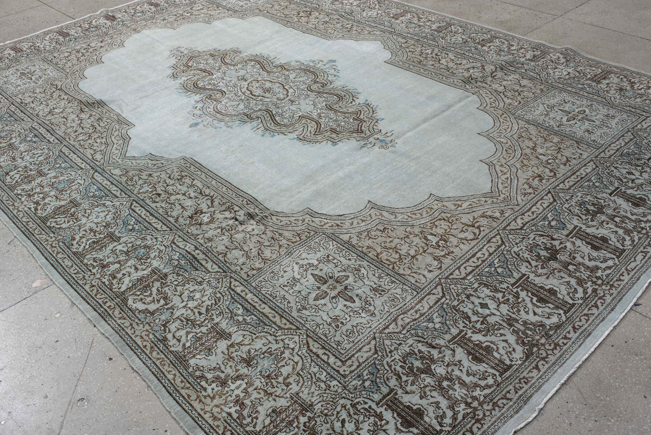 9' x 12' one-of-a-kind handmade vintage large size rug. Color palette: pale blue, ivory, taupe, brown, sky blue, light blue