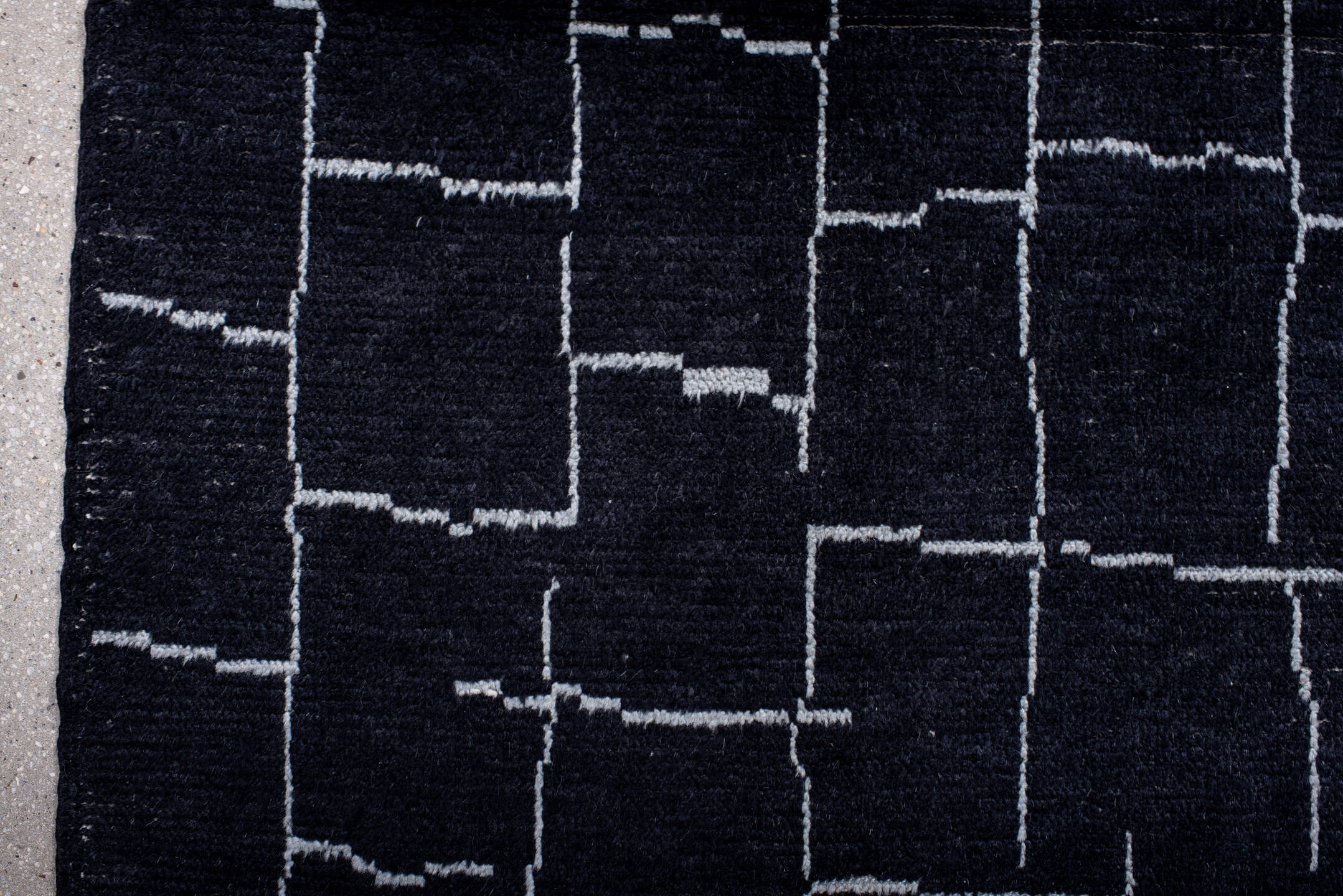 7' x 9' one-of-a-kind handmade vintage Moroccan rug. Color palette: gray, light blue, blue, light gray, off-white, black