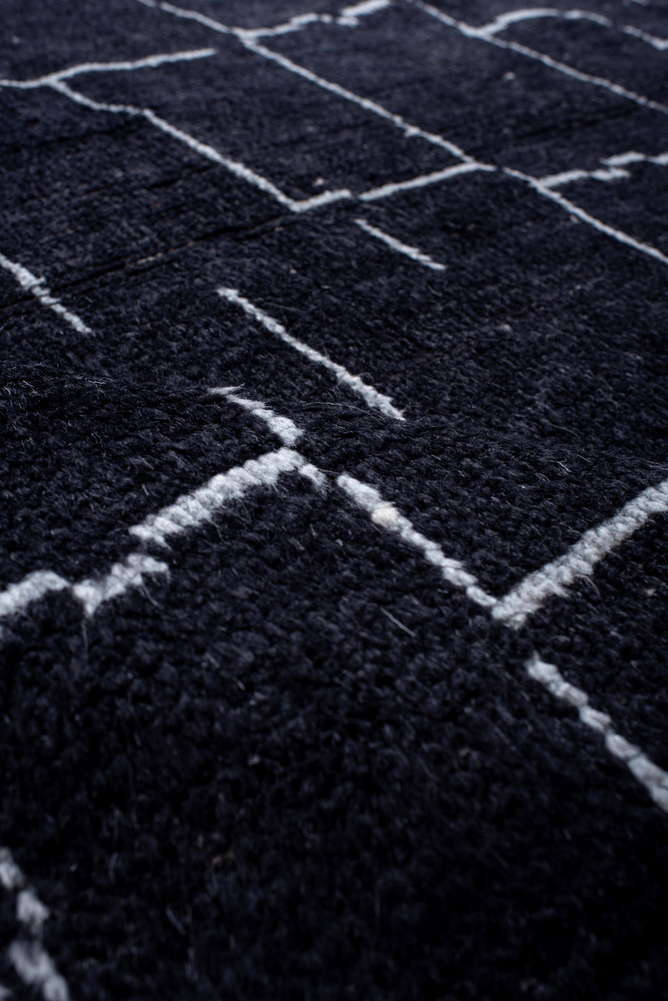 7' x 9' one-of-a-kind handmade vintage Moroccan rug. Color palette: black, blue, gray, lavender, light blue, light gray