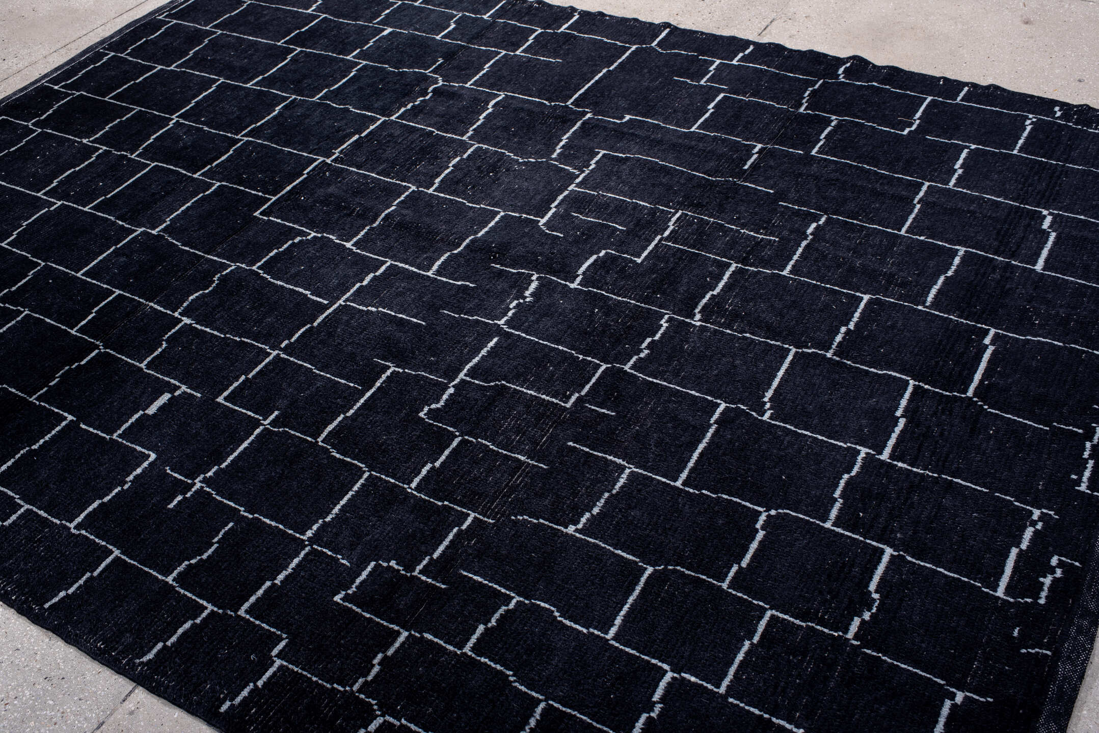 7' x 9' one-of-a-kind handmade vintage Moroccan rug. Color palette: gray, light blue, blue, light gray, off-white, black