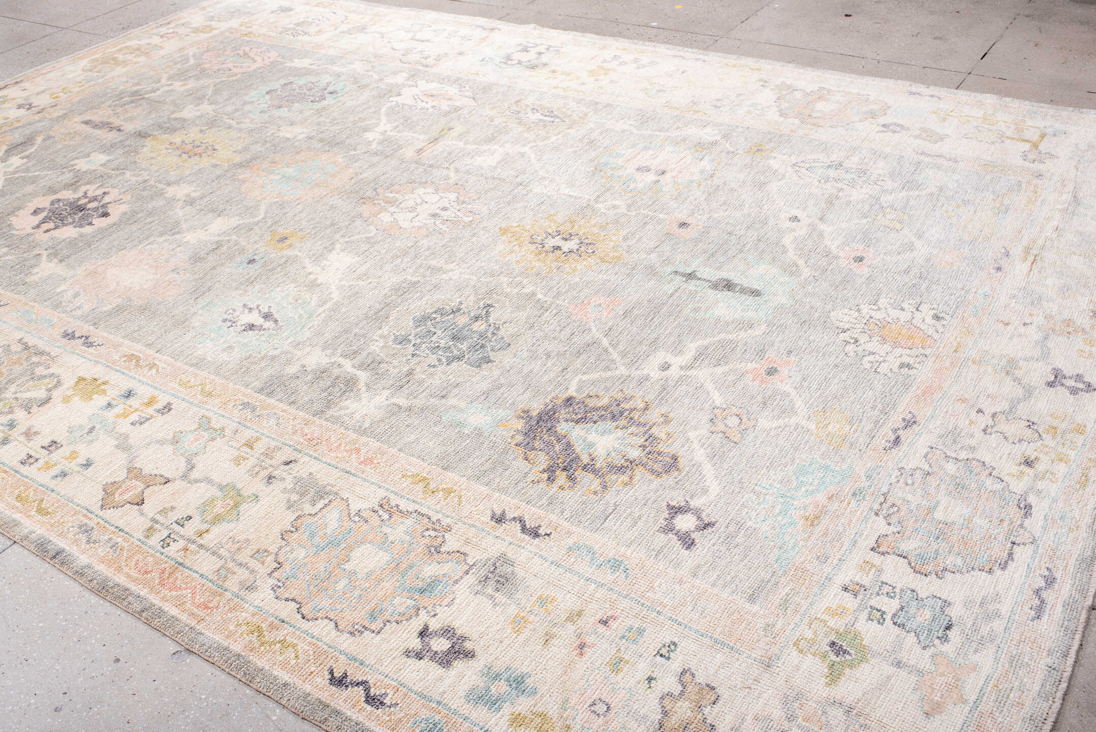 9' x 14' one-of-a-kind handmade vintage Oushak large size rug. Color palette: gray, ivory, blush, aqua, lavender, gold