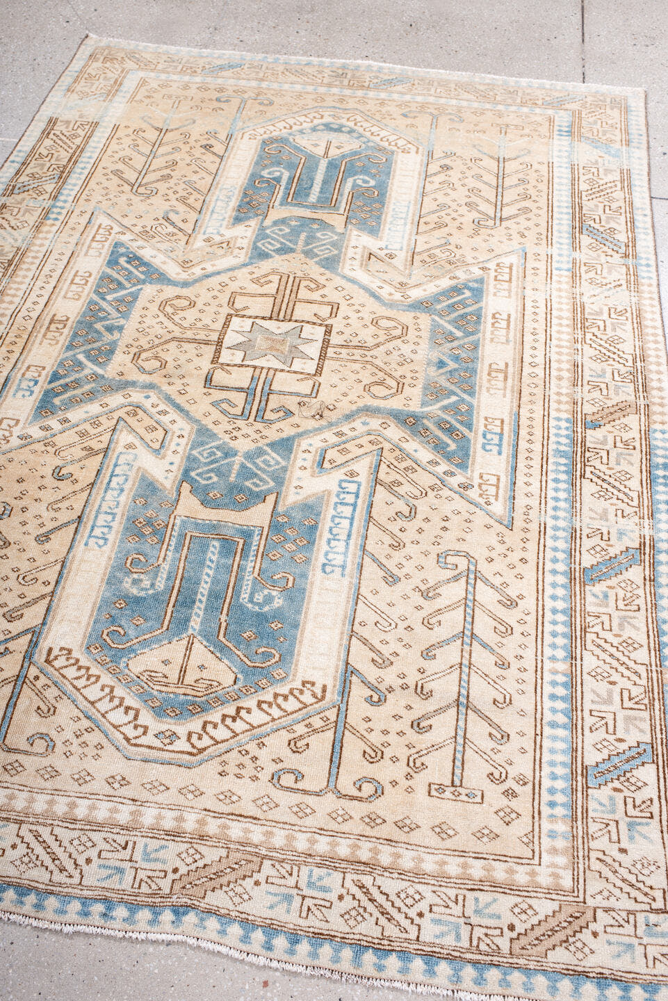 4' x 6' one-of-a-kind handmade vintage Anatolian rug. Color palette: ivory, sky blue, camel, taupe, beige, brown, light blue