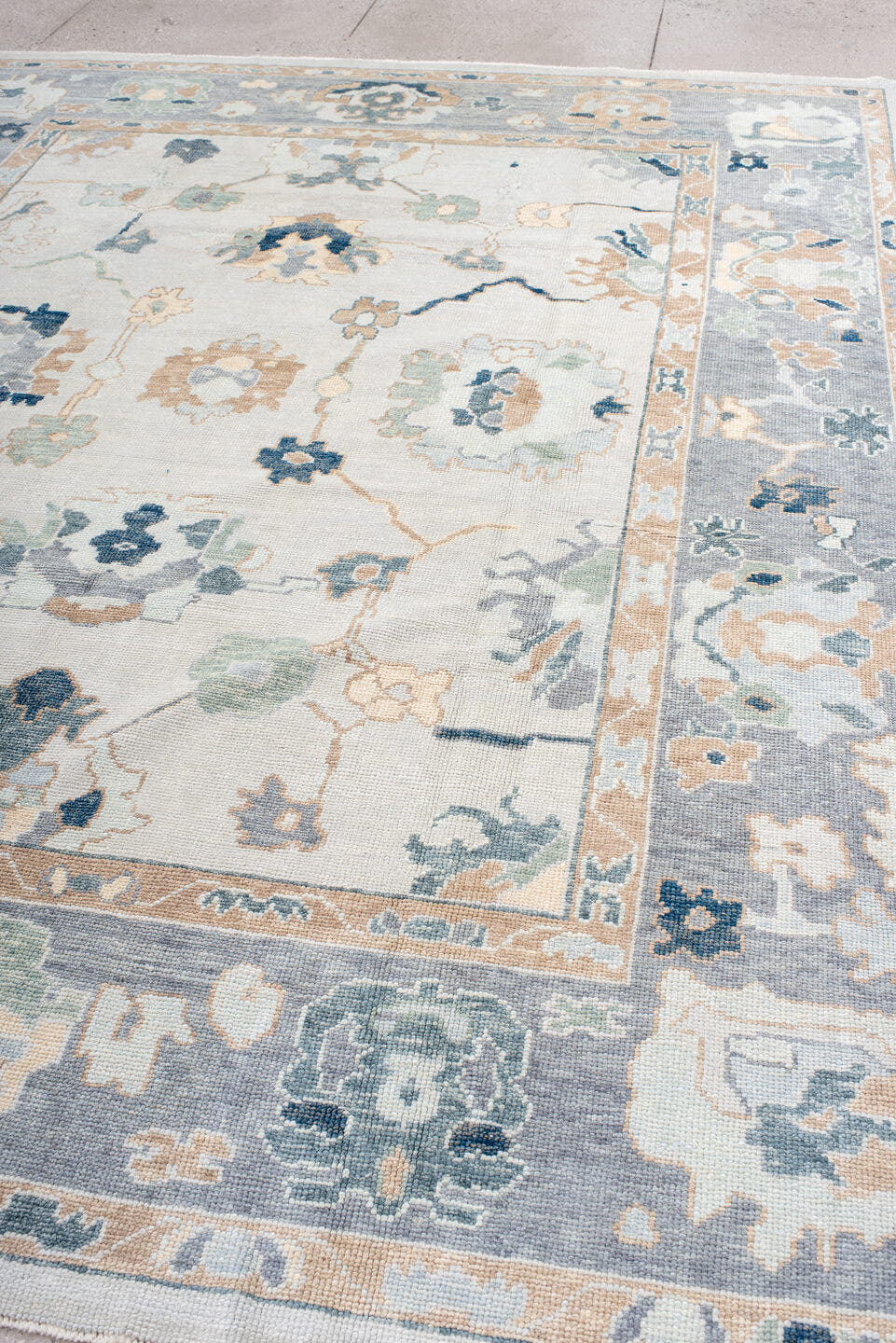 9' x 11' one-of-a-kind handmade vintage Oushak large size rug. Color palette: ivory, slate, peach, sage, navy, cream, taupe