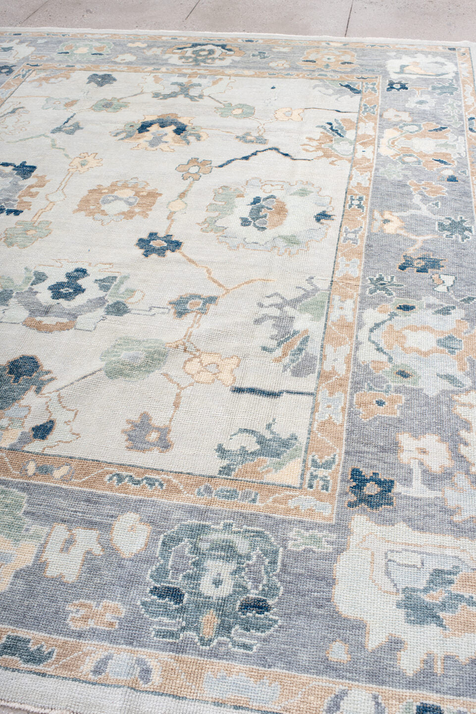 9' x 11' one-of-a-kind handmade vintage Oushak large size rug. Color palette: ivory, slate, peach, sage, navy, cream, taupe