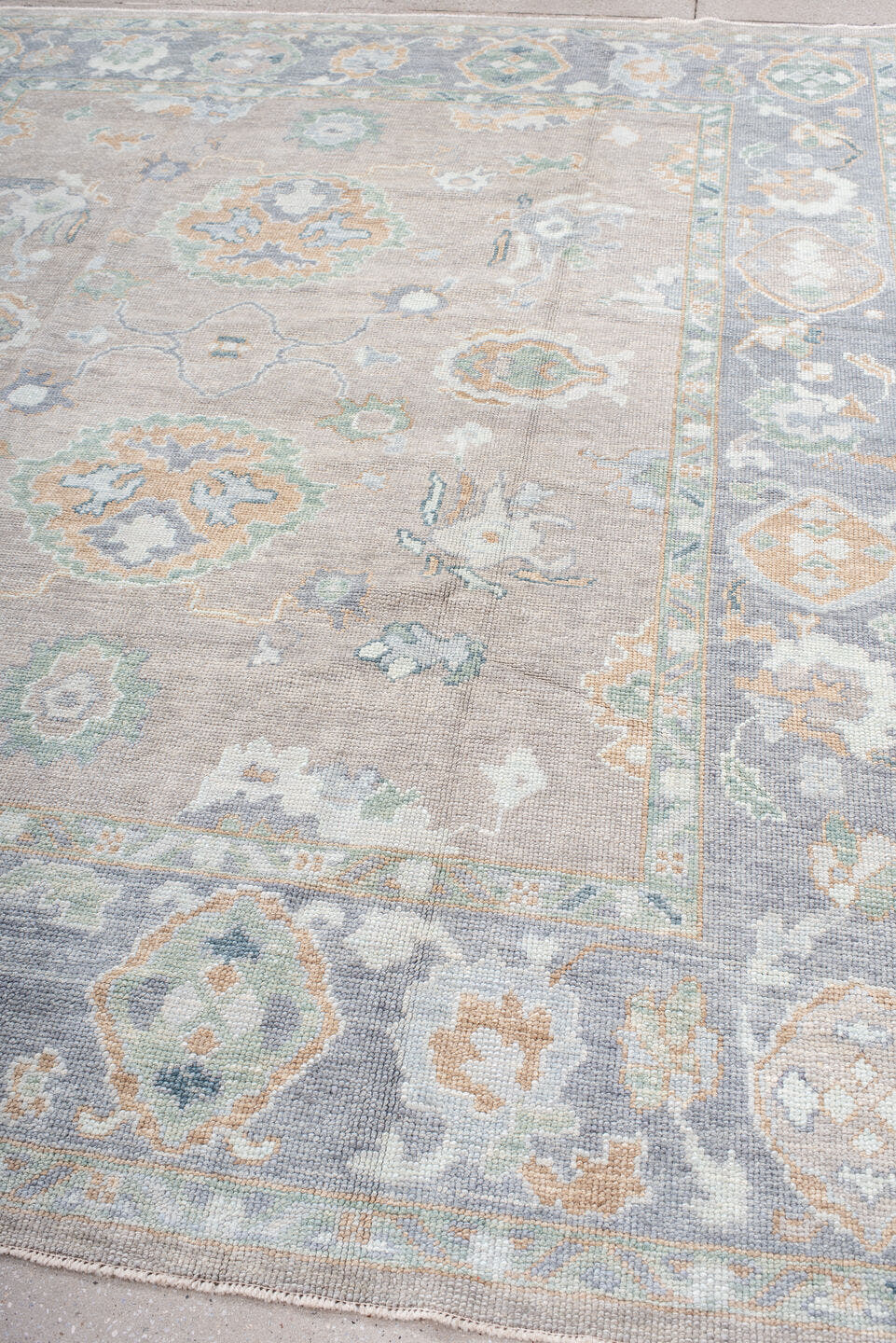8' x 9' one-of-a-kind handmade vintage Oushak rug. Color palette: taupe, pale blue, ivory, sage, soft gold, peach, slate