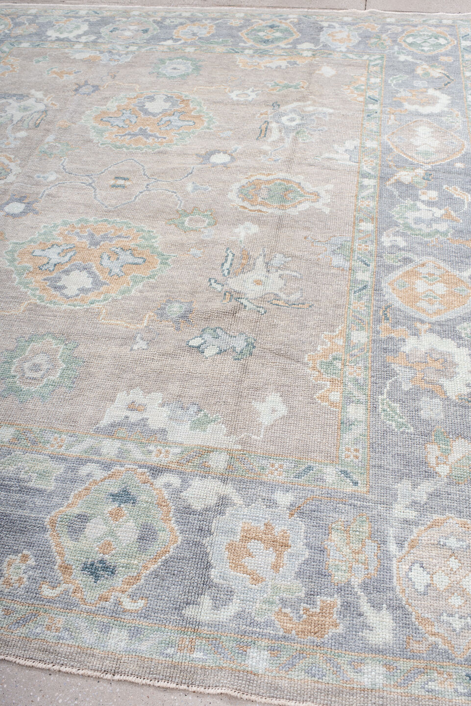 8' x 9' one-of-a-kind handmade vintage Oushak rug. Color palette: taupe, pale blue, ivory, sage, soft gold, peach, slate