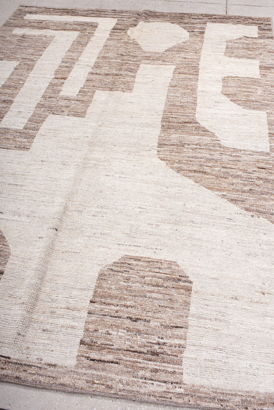 6' x 8' one-of-a-kind handmade vintage Tulu medium size rug. Color palette: ivory, taupe, beige, camel, gray