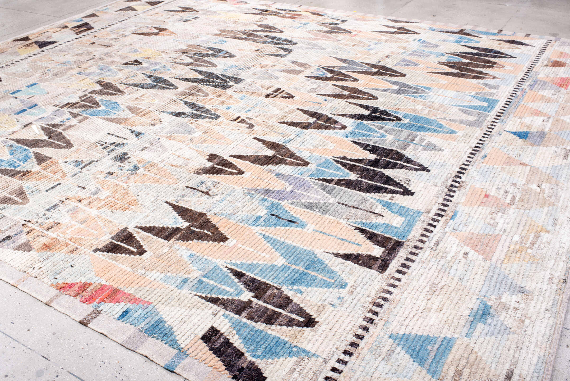 12' x 15' one-of-a-kind handmade vintage Tulu oversize rug. Color palette: ivory, charcoal, sky blue, blush, taupe
