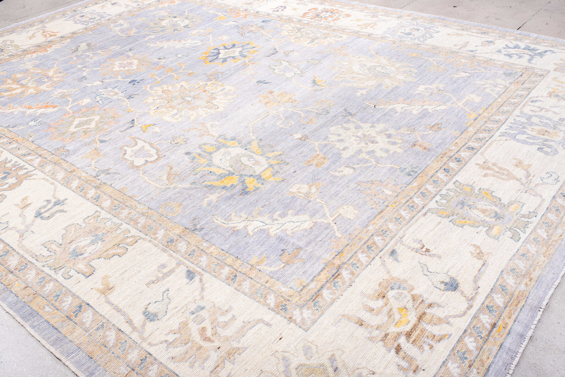 11' x 15' one-of-a-kind handmade vintage Oushak oversize rug. Color palette: lavender, ivory, pale gold, soft blue, taupe