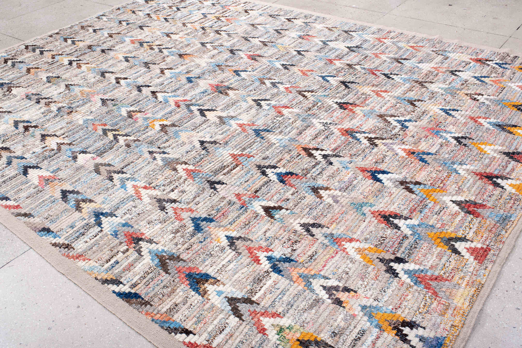 9' x 12' one-of-a-kind handmade vintage Tulu large size rug. Color palette: ivory, sky_blue, charcoal, taupe, rust, gold