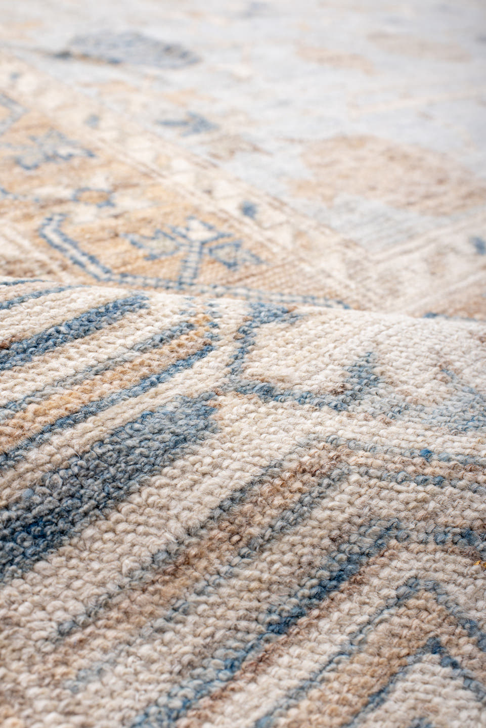 12' x 15' one-of-a-kind handmade vintage Khotan oversize rug. Color palette: ivory, pale blue, sand, beige, taupe