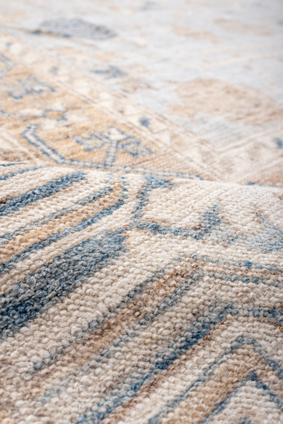 12' x 15' one-of-a-kind handmade vintage Khotan oversize rug. Color palette: ivory, pale blue, sand, beige, taupe