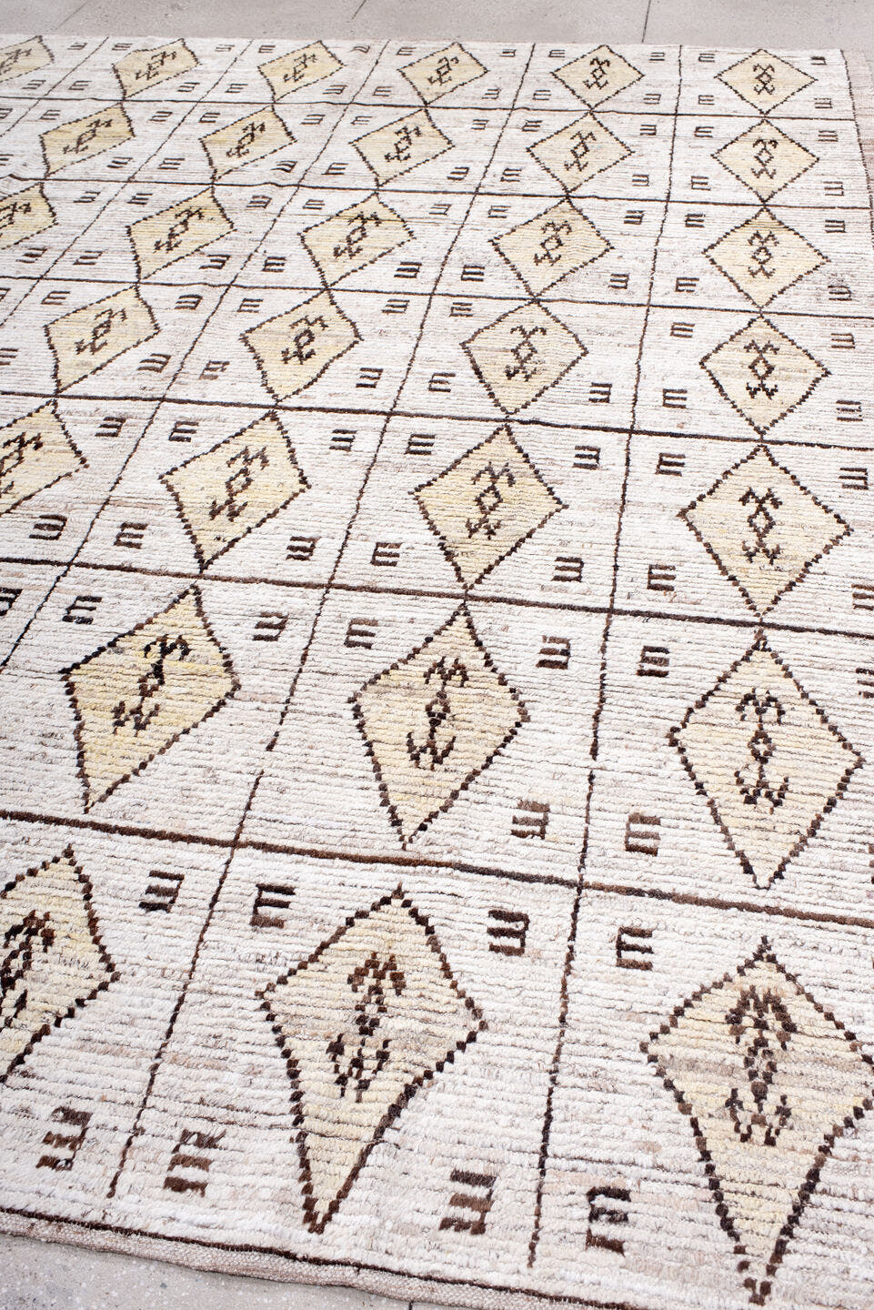 9' x 11' one-of-a-kind handmade vintage Tulu large size rug. Color palette: cream, ivory, taupe, brown, camel, beige, gray