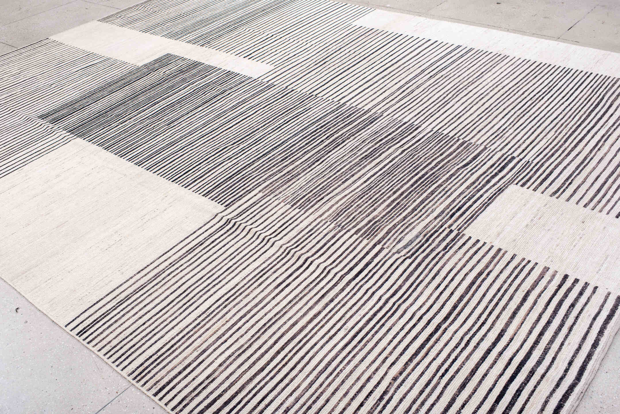 10' x 13' one-of-a-kind handmade vintage Tulu large size rug. Color palette: ivory, charcoal, gray, black