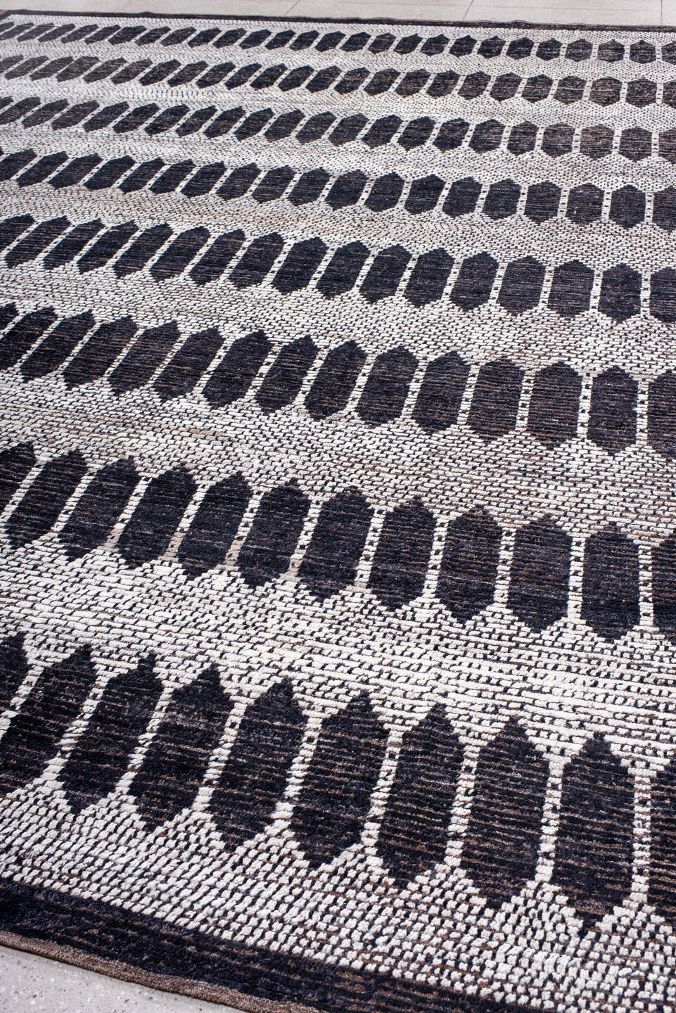 12' x 15' one-of-a-kind handmade vintage Tulu oversize rug. Color palette: ivory, charcoal, taupe, brown, gray, black, beige