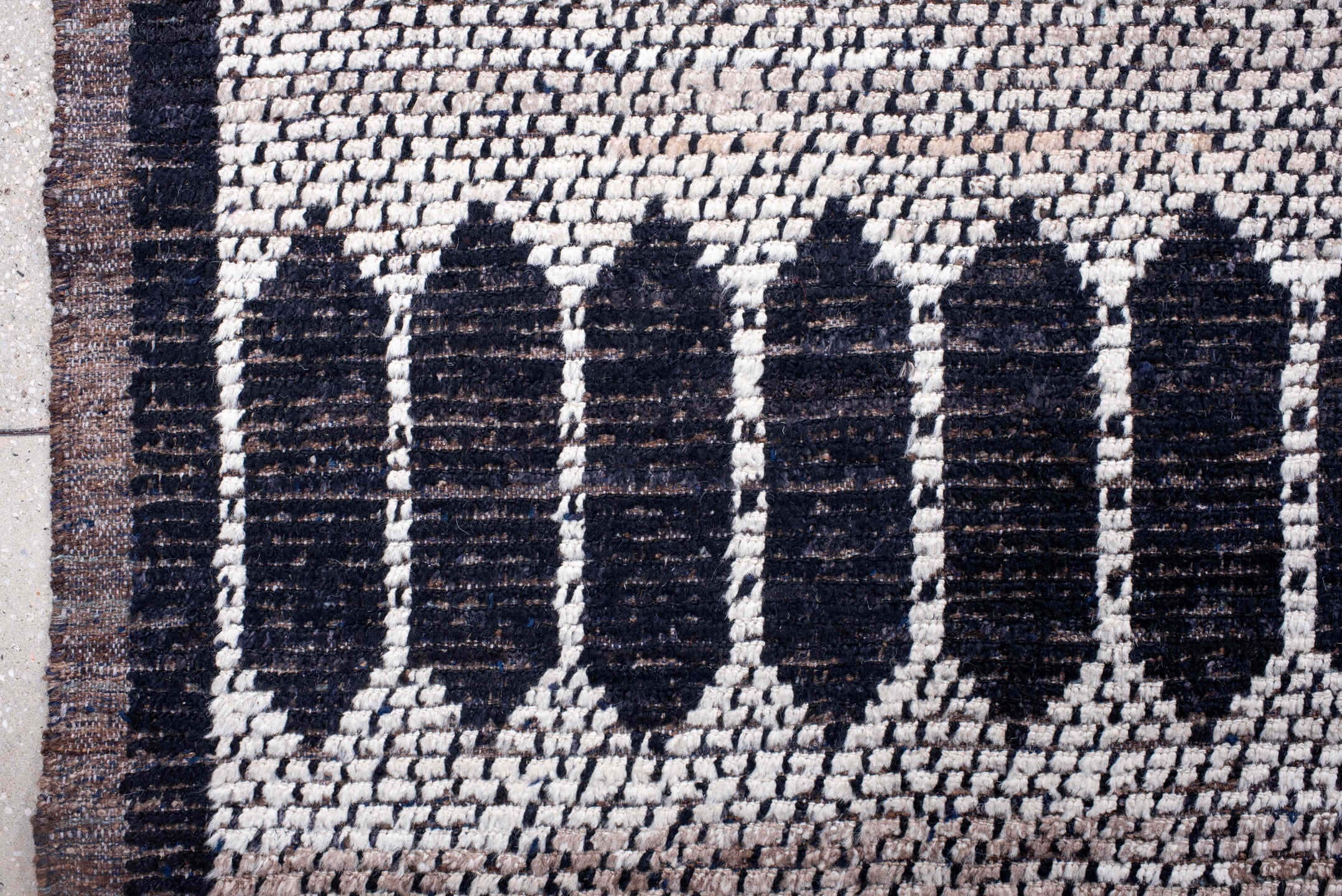 12' x 15' one-of-a-kind handmade vintage Tulu oversize rug. Color palette: ivory, charcoal, taupe, brown, gray, black, beige
