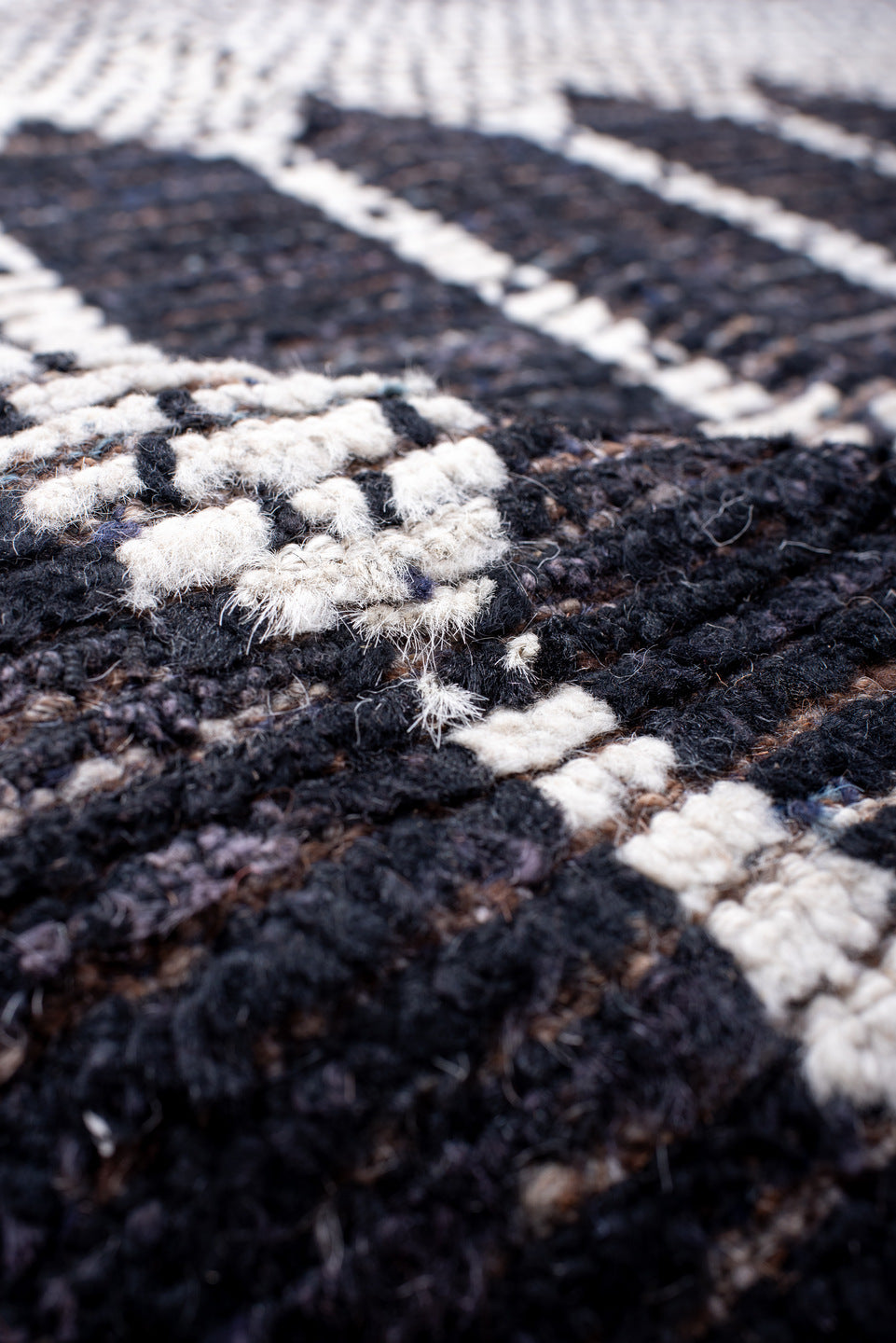 12' x 15' one-of-a-kind handmade vintage Tulu oversize rug. Color palette: ivory, charcoal, taupe, brown, gray, black, beige