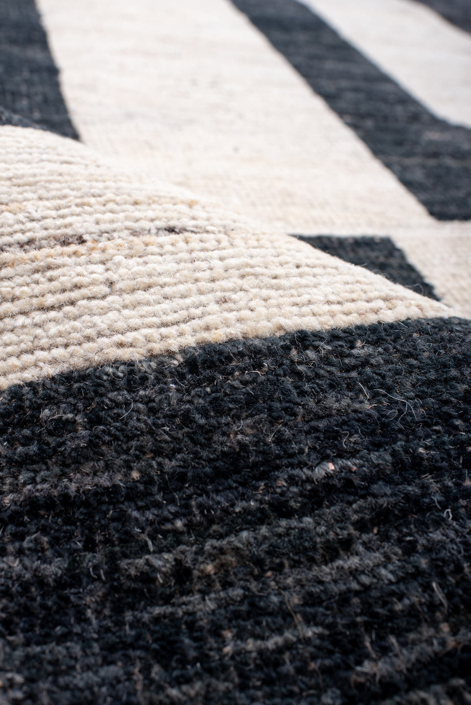 13' x 17' one-of-a-kind handmade vintage Tulu oversize rug. Color palette: ivory, charcoal, light gray, taupe, gray, black