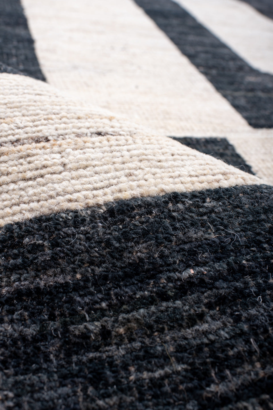 13' x 17' one-of-a-kind handmade vintage Tulu oversize rug. Color palette: ivory, charcoal, light gray, taupe, gray, black