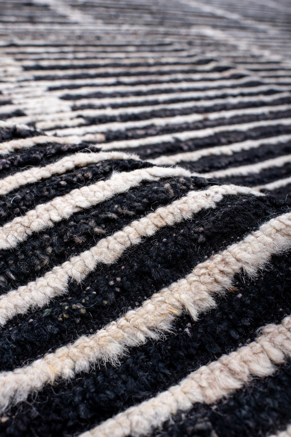 13' x 19' one-of-a-kind handmade vintage Tulu oversize rug. Color palette: charcoal, ivory, slate, black, gray