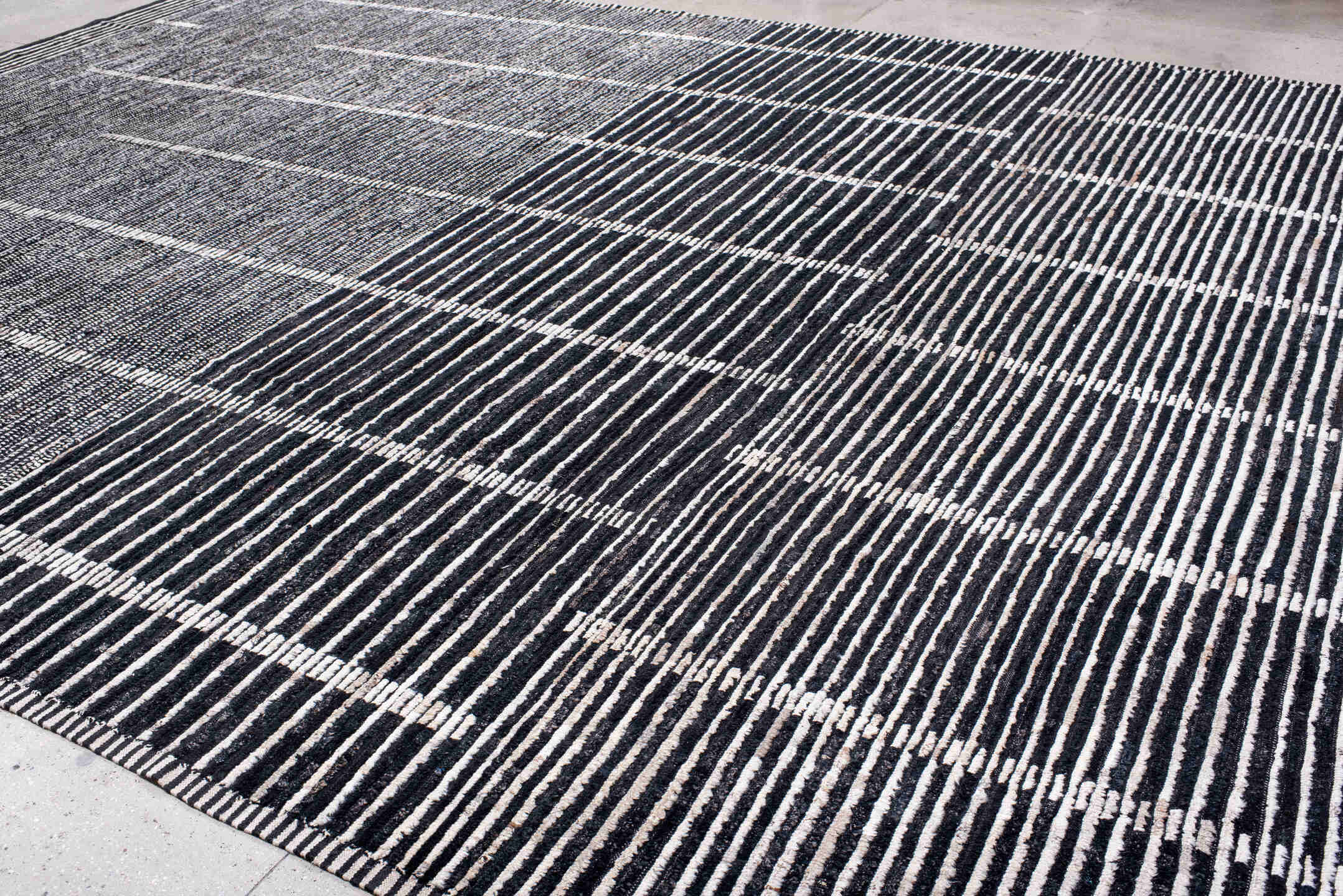 13' x 19' one-of-a-kind handmade vintage Tulu oversize rug. Color palette: charcoal, ivory, slate, black, gray