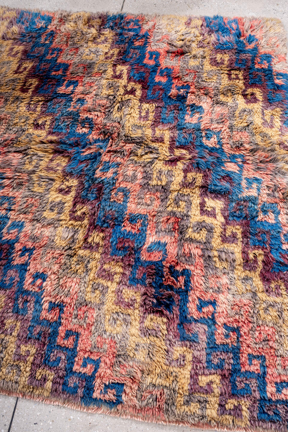4' x 5' one-of-a-kind handmade vintage Moroccan small size rug. Color palette: taupe, blue, gold, plum, coral, gray, beige
