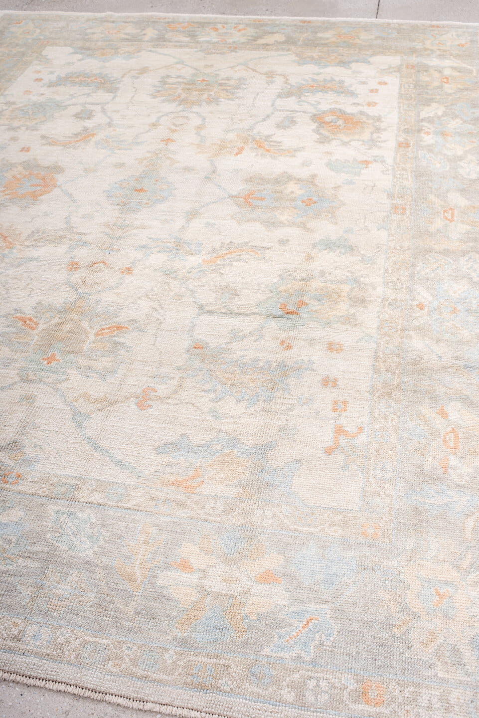 8' x 10' one-of-a-kind handmade vintage Oushak large size rug. Color palette: ivory, pale blue, blush, cream, taupe, peach
